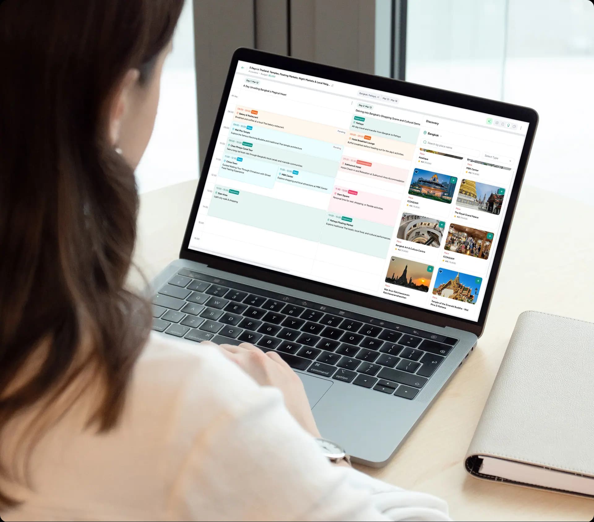 Travel professional reviewing itineraries on a laptop